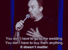 a man is holding a microphone and saying you don t have to go to the wedding