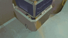 a computer generated image of a machine with a purple box on top of it