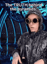 a man wearing goggles and a hooded jacket with the words the truth behind the pyramids