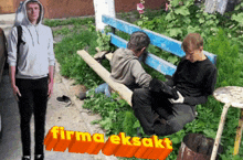 a man in a hoodie is standing next to two men sitting on a bench with the words firma eksakt written on the bottom