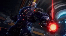 a man in a robot suit is holding a red light in his hand and says `` success '' .