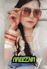 a woman wearing sunglasses with the name arbeena on the bottom right
