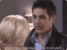 a man and a woman are looking at each other and the man is asking the woman how happy he was to see her