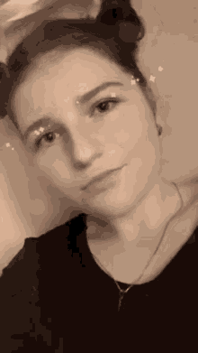 a black and white photo of a woman 's face