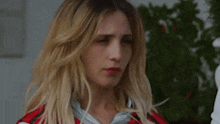 a close up of a woman making a funny face .