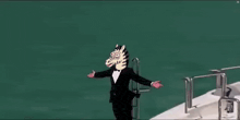 a man wearing a horse mask is standing on a yacht .