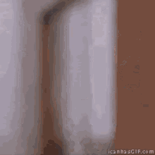 a blurry picture of a person wrapped in a white towel