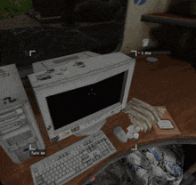 a computer monitor sits on a wooden desk next to a keyboard and mouse