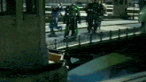 a group of transformers are standing on a bridge