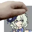 a hand is touching a cartoon girl 's face with a hat on .