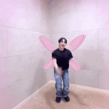 a man with pink wings is jumping in the air