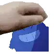 a hand is holding a blue cartoon character with a big smile on it 's face .