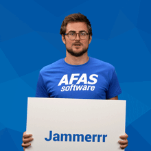 a man in a blue afas shirt holds up a sign