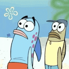 a couple of cartoon fish standing next to each other on the beach .