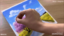 a person is painting a picture with white and magenta paints
