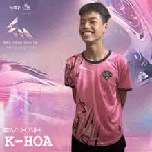 a young man wearing a pink shirt with the name k-hoa on the front