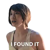 a woman in a yellow tank top with the words i found it on the bottom