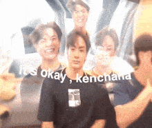 a blurry picture of a man with the words it 's okay kenchana written on the bottom