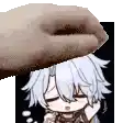 a hand is holding a cartoon character 's head in front of a black background .