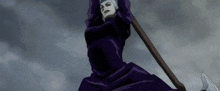 a woman in a purple dress is holding a large axe in her hands .