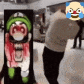 a man is standing in front of a clown with a bloody face