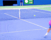 a tennis match is being played in front of a chase wall