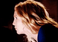 a close up of a woman 's face with blonde hair