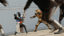 a man in a mask is holding a sword and another man in a mask is holding a sword