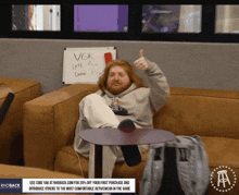 a man is giving a thumbs up in front of a white board that says vgk
