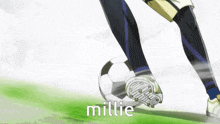 a person kicking a soccer ball with millie written on the side