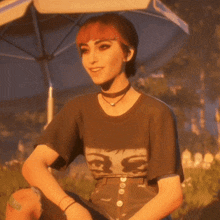 a woman wearing a t-shirt that has eyes on it