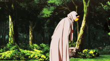 a man in a white cape stands in a forest with a flame coming out of his mouth