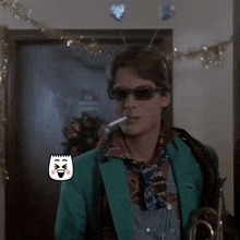 a man wearing sunglasses and a green jacket is smoking a cigarette and holding a trumpet