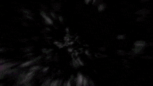 a silhouette of a person standing in front of a black hole in the middle of a white background .