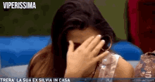 a woman is covering her face with her hand and the words viperissima are on the bottom of the screen