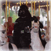 darth vader is riding a merry go round with storm trooper riders