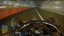 a race car is driving through a tunnel and the driver is named hadjar
