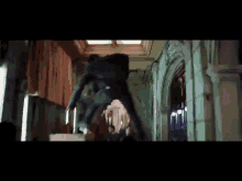 a man is jumping in the air in a hallway