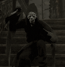 a person with a mask on their face holding a knife