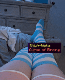 thigh-highs curse of binding is displayed on a person 's leg
