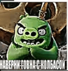 a green pig from the angry birds movie is wearing headphones and a skull .