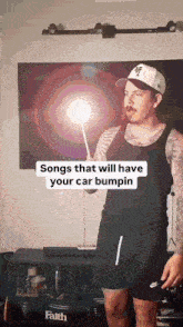 a man is holding a stick in front of a tv with the words songs that will have your car bumpin on it