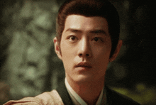 a close up of a man 's face with a very serious look on his face