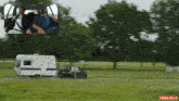 a car pulling a trailer with the word think jules on the bottom right