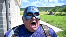 a man in a captain america costume with his mouth wide open