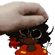 a person is petting a cartoon character 's head with their hand .