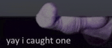 a close up of a person 's finger with the words `` yay i caught one '' written on it .
