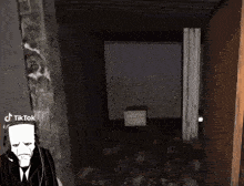a man in a suit and tie is standing in a dark room with a sign that says tiktok on it