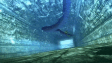 a snake is swimming in a tunnel with a brick wall