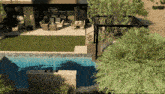 an aerial view of a house with a pool
